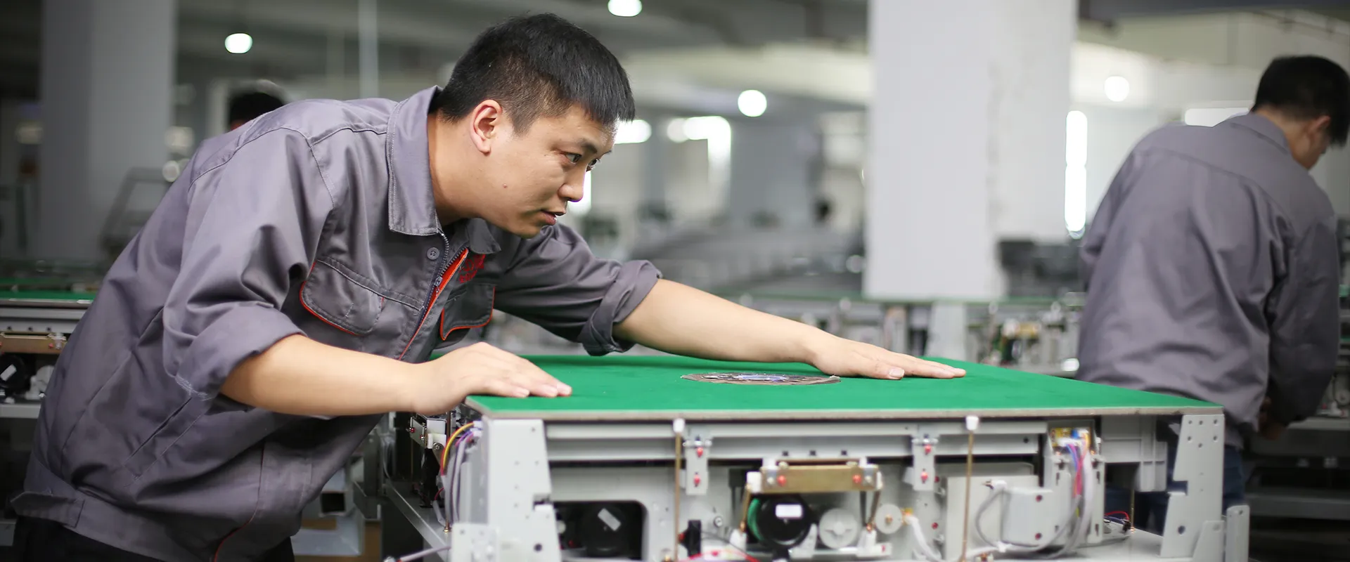 a male technician adjusts the machine